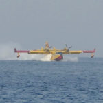 Firebrigade plane filling water