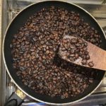 Roasting coffee beans in the frying pan