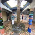 A living tree takes centre stage at the public toilets in Kawakawa