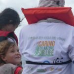 Volunteers wear the Green Heritage Fund Suriname shirt